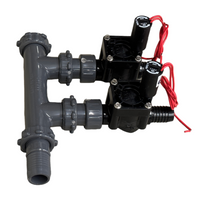 Two-valve Hunter 1-inch PGV manifold assembled with poly pipe adapters and union seals, highlighting compact layout and tool-less servicing features, on white background.