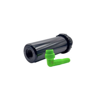Angled detail shot of KFIT-IT fitting showing spiral barb entry and thread interfaces for rotor and drip connections in bright green.