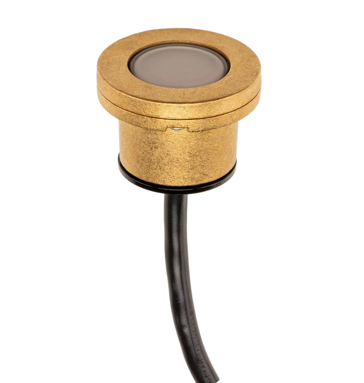 Side view of FX Luminaire LP 3-LED underwater light in natural brass highlighting low-profile form, lens, and tamper-resistant features.