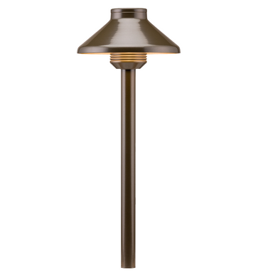 FX DL path light in bronze finish shown with 18-inch riser and frosted lens, installed in landscape context, front view, metal housing and spike visible.
