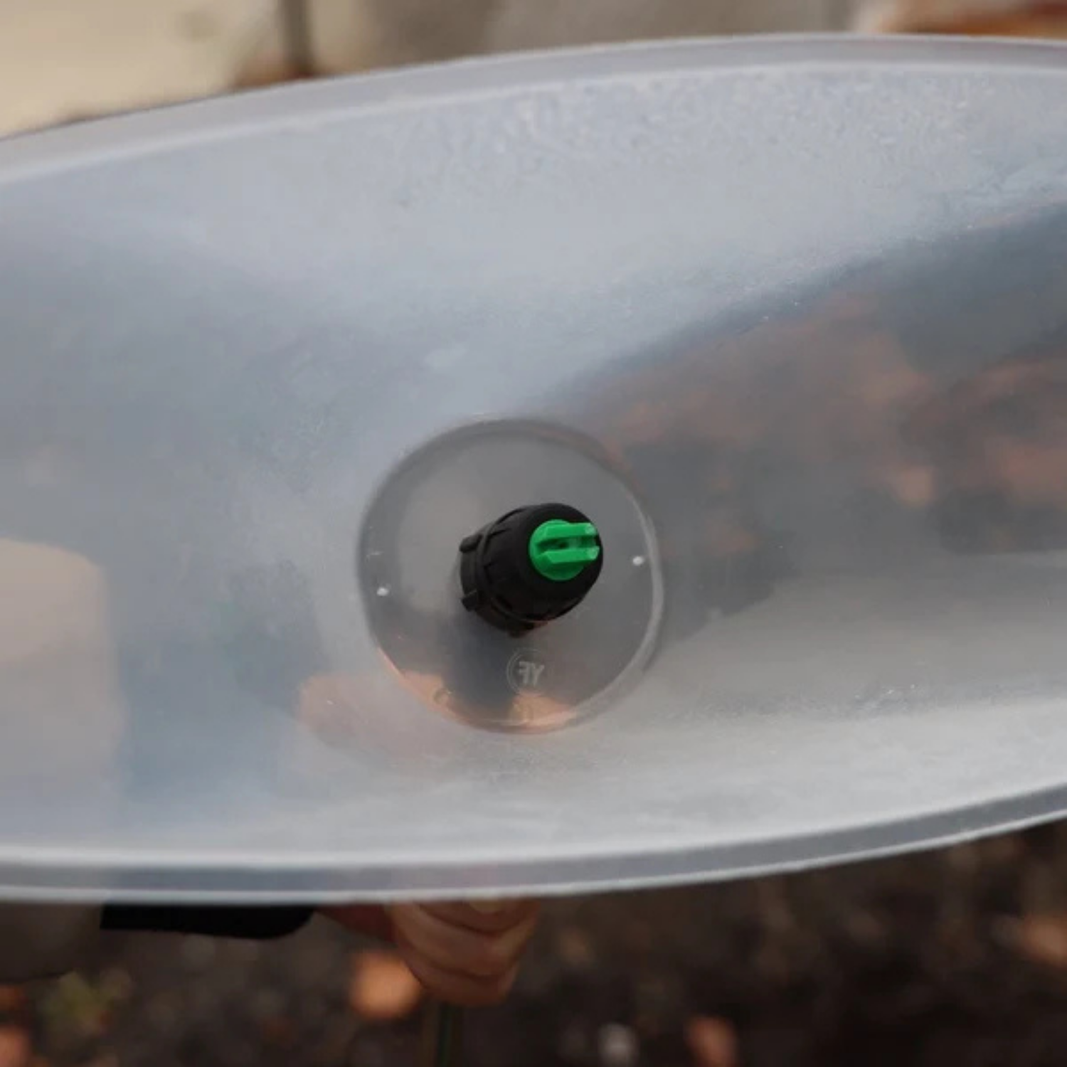 FlowZone Drift Guard installed on a sprayer, showing coverage pattern direction.