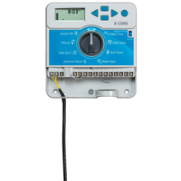 Hunter X-CORE XC800I indoor controller installed on wall with visible program interface and multiple station labels, demonstrating larger 8-station configuration suitability.
