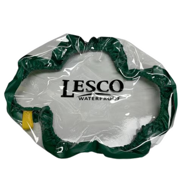 Clear LESCO waterproof hopper cover fitted over a walk-behind fertilizer spreader, protecting hopper contents from rain and preventing spills while allowing easy visual checks.