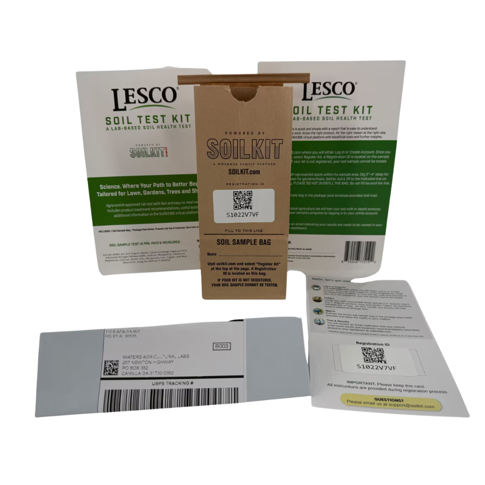 Close-up of SoilKit365 contents: labeled sample bags, instruction booklet and prepaid return envelope for mail-in lab testing.
