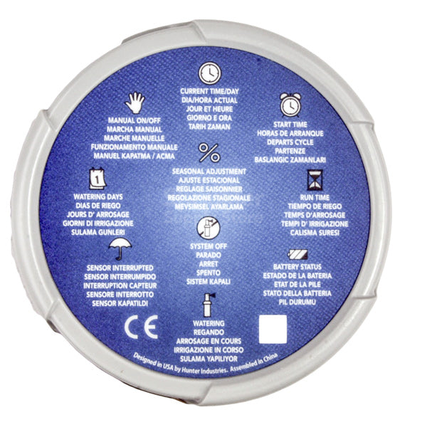 Angled view of Hunter NODE two-station battery controller with visible wiring terminals, LCD, and mounting bracket for valve-box installation.