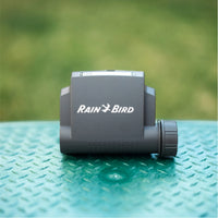 Front view of Rain Bird ESP-BAT-BT 1-station Bluetooth battery-operated irrigation controller showing the compact weatherproof case.