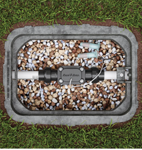 Close-up of Rain Bird FG100 paddle-wheel impeller housing and wiring port; designed for 18g irrigation wire and in-ground installation.