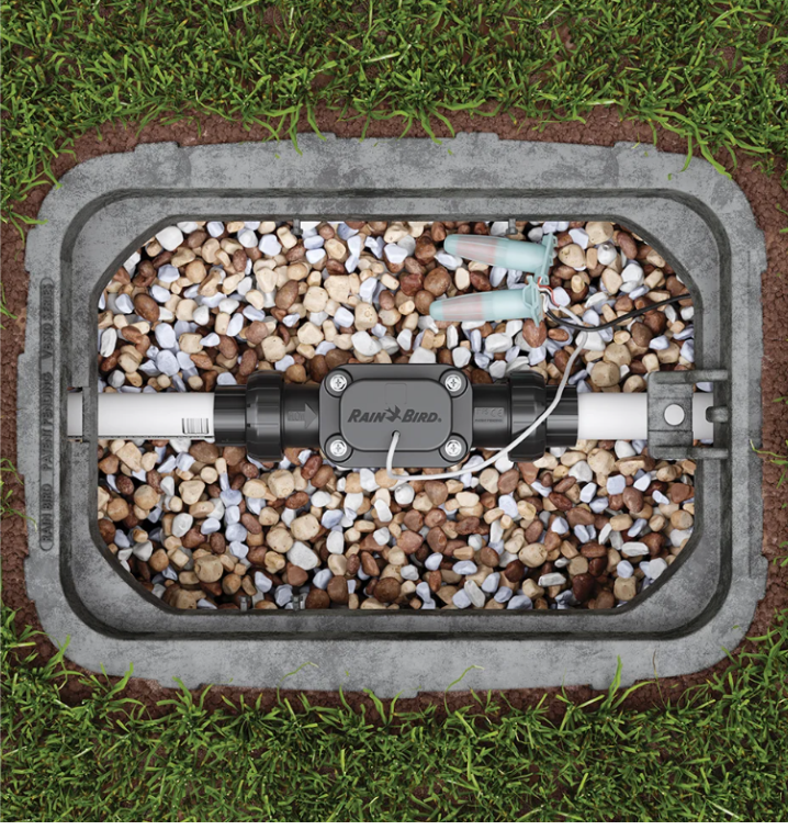 Close-up of Rain Bird FG100 paddle-wheel impeller housing and wiring port; designed for 18g irrigation wire and in-ground installation.