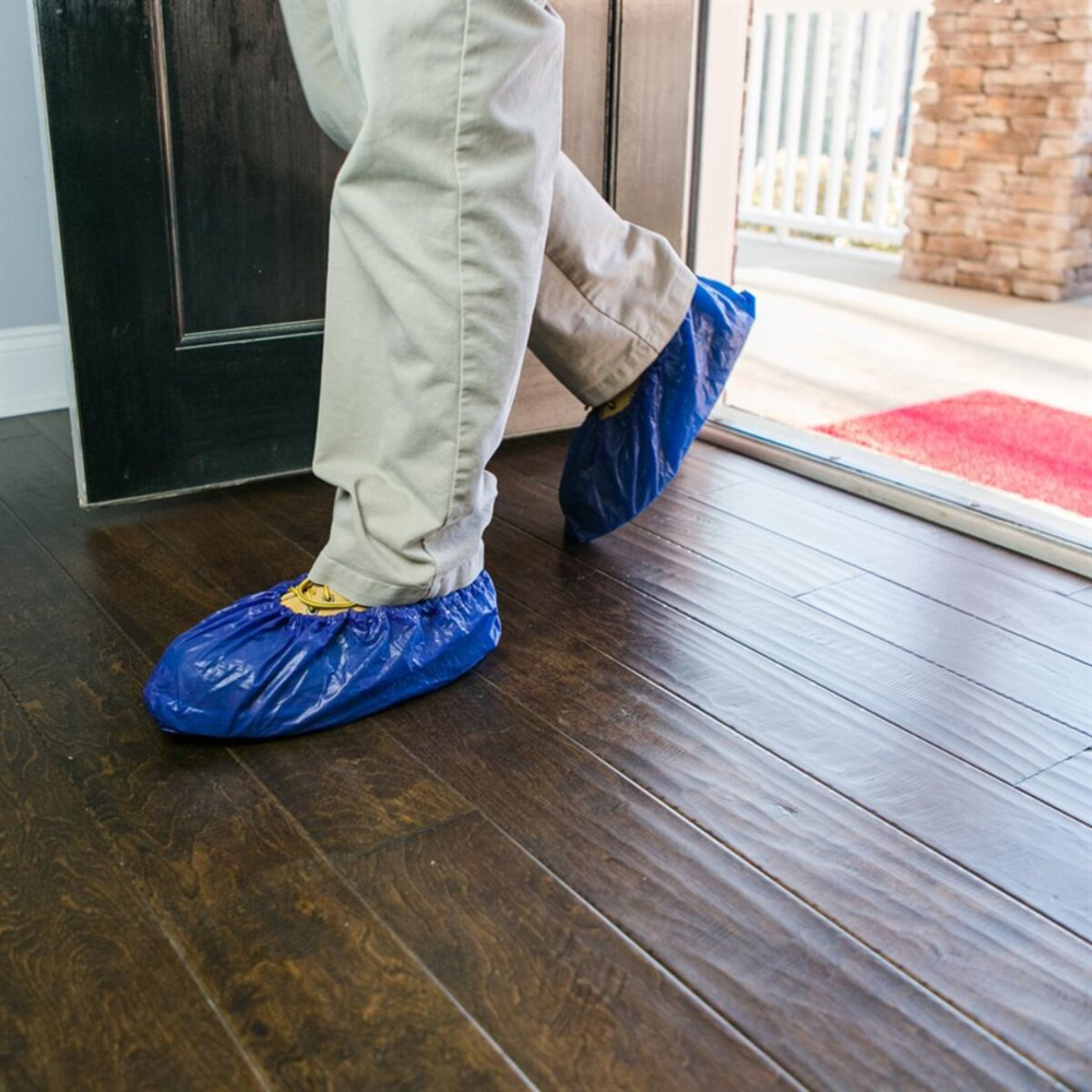 Close-up of ShuBee dark blue waterproof shoe cover sole highlighting textured slip-resistant tread and reinforced bottom.