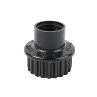 Close-up of Toro 570S shrub adapter showing 1/2 in female threaded inlet and molded black plastic body for shrub irrigation (close view).