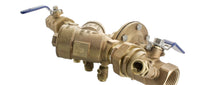 Top angle view showing relief valve and identification tag on Wilkins 975XLU 1-inch reduced-pressure assembly for irrigation systems.