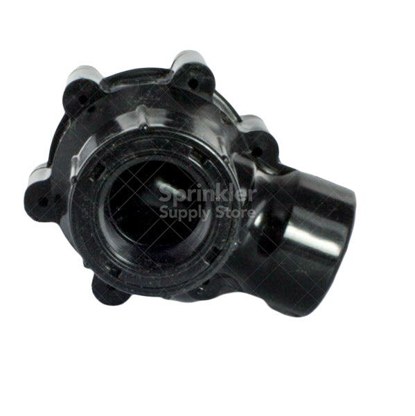 Rain Bird 100DVA installed in a valve box with piping connections visible, showing angle orientation and compact footprint.