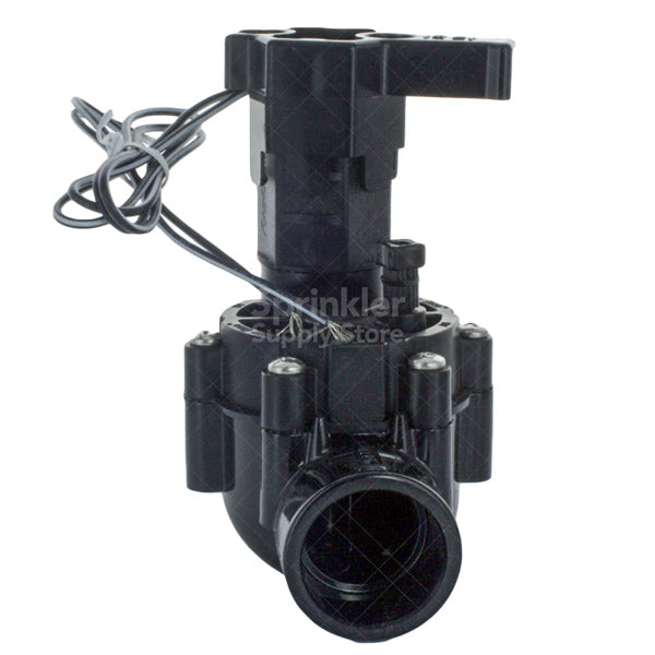 Side view of Rain Bird 100DVSS 1-inch electric valve showing inlet/outlet ports and external bleed port for flushing debris.