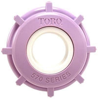 Close-up of Toro 102-1211 lavender molded cap cover and sealing insert for 570 spray sprinkler, showing outer profile and seal lip.