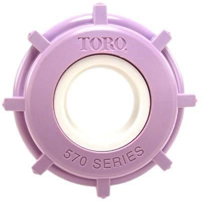 Close-up of Toro 102-1211 lavender molded cap cover and sealing insert for 570 spray sprinkler, showing outer profile and seal lip.
