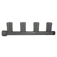 Front view of 1" PVC quad manifold female (SKU 1201-410) showing the inlet and four outlet ports with nut-style connectors, on white background.