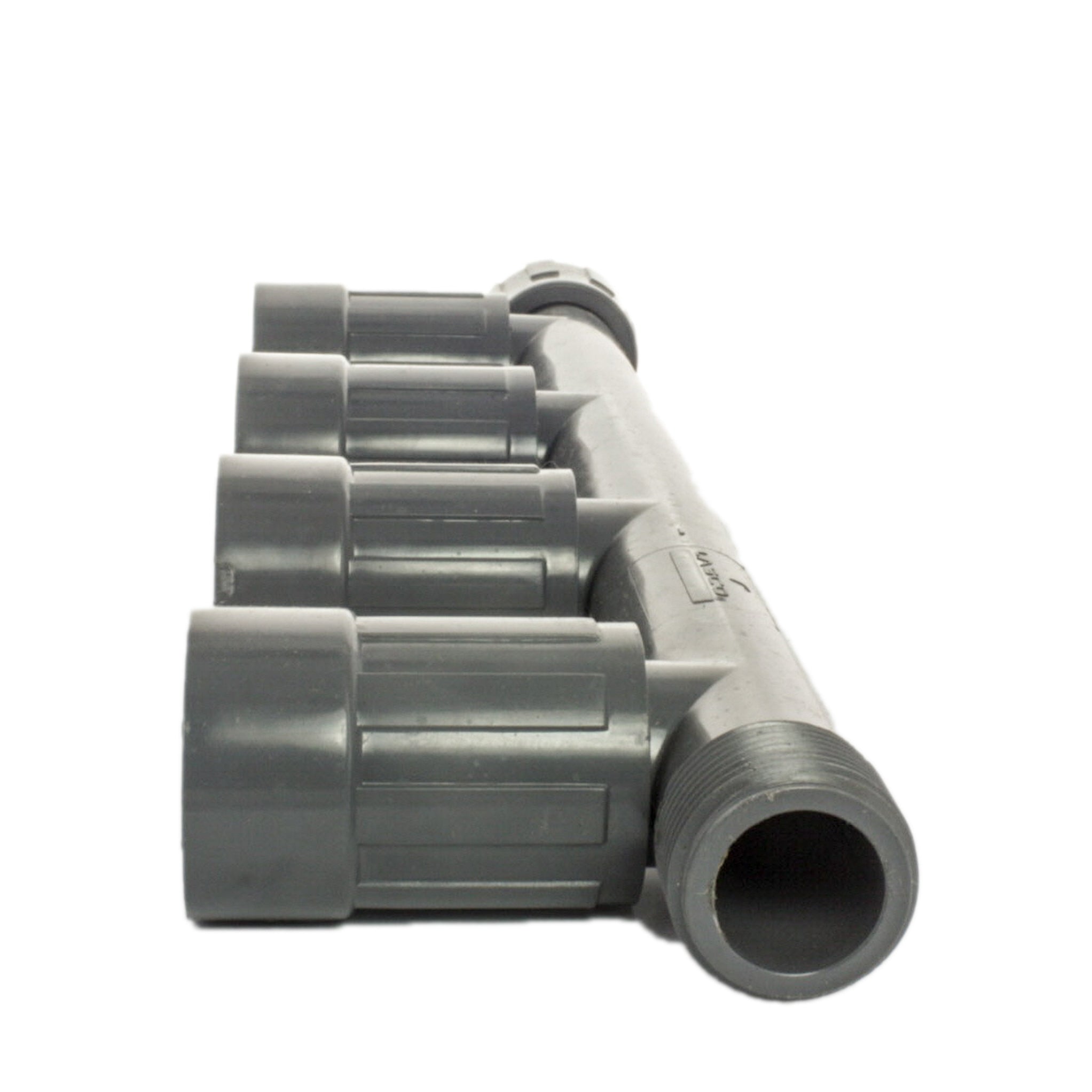Close-up of 1" PVC quad manifold female (SKU 1201-410) illustrating PVC body, connection faces, and four outlet ports for multi-zone irrigation hookups.