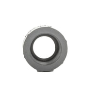 Side-angle photo showing threaded ends of PVC adapter 1" male to 3/4" female, highlighting thread profile and shoulder.