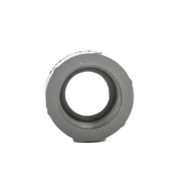 Side-angle photo showing threaded ends of PVC adapter 1" male to 3/4" female, highlighting thread profile and shoulder.