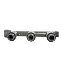 Side view close-up of 1301-310 Triple Tee showing the nut, male thread, and valve connection interfaces on the durable PVC body.