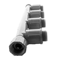 Perspective view of model 1301-410 PVC quad tee manifold highlighting outlet orientation and compact design for zone splitting.