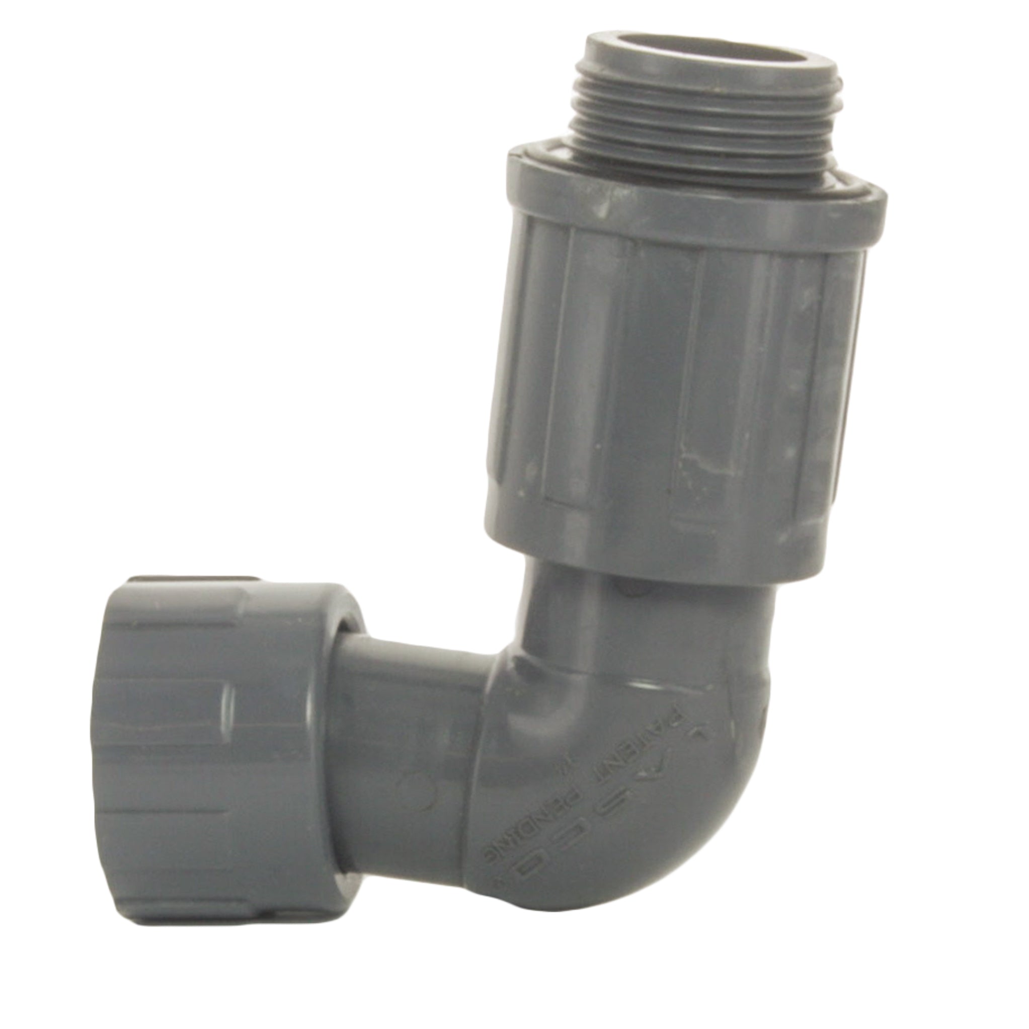 White 1-inch PVC manifold elbow photographed at an angle showing the female inlet and valve-side NUT x MVCONN connection, used for irrigation manifolds.