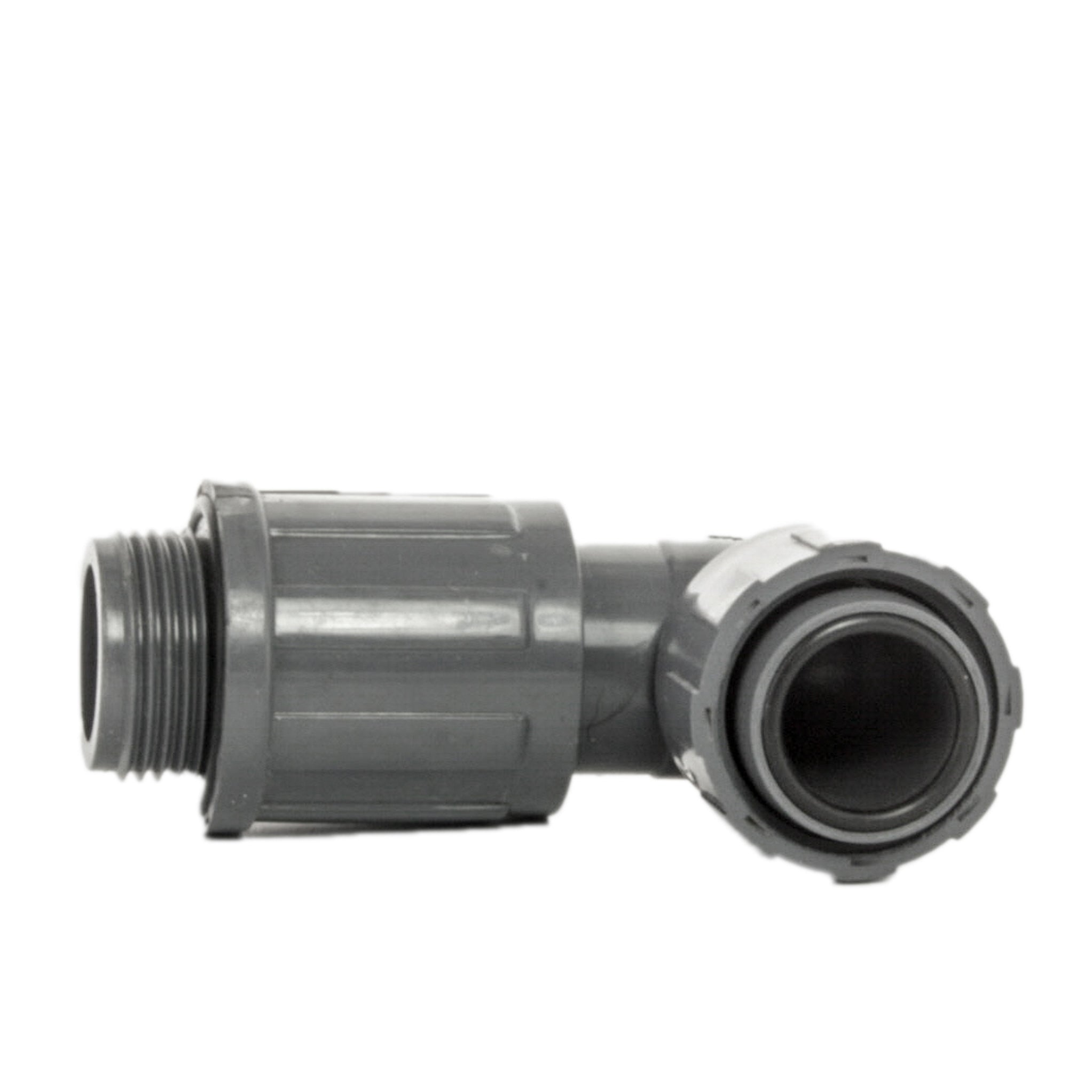 Close-up view of the 1" PVC manifold elbow highlighting the threaded female inlet and NUT x MVCONN valve interface for irrigation systems.