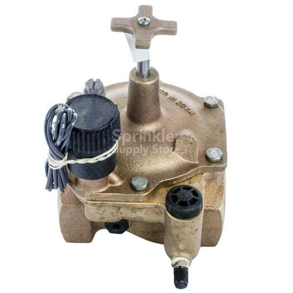 Angled view of Toro 220-26-08 2" electric in-line brass valve showing overall assembly, solenoid, and female x female inlet fittings.