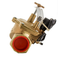 Close-up of Toro 220-27-08 valve solenoid and EZ Reg pressure regulator module mounted on brass valve body for irrigation systems.
