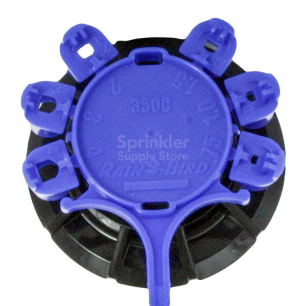 Top and nozzle assembly of Rain Bird 3504-PC-SAM rotor showing Rain Curtain nozzle tree and top-adjust arc screw.