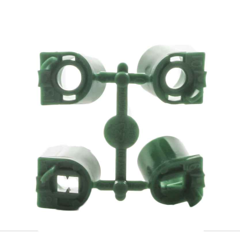 Hunter replacement nozzle rack (part 444800) photographed with four green high-flow nozzles removed and arranged to show included sizes and storage rack.