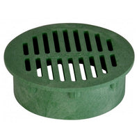 Top view of NDS Model 50 6" green round drainage grate showing slotted open surface and outer rim for Spee-D basin installation, visible texture.