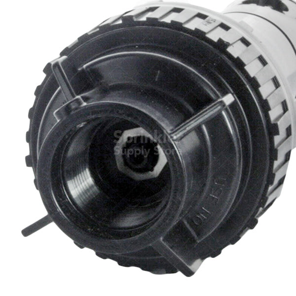 Rain Bird 5000S Plus PC SAM non-potable rotor installed in turf area with purple cover visible, showing body and pop-up mechanism.