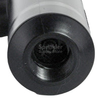 Rain Bird 5006PC rotor installed, close-up of body and exposed diameter with visible inlet connection area and cap detail.