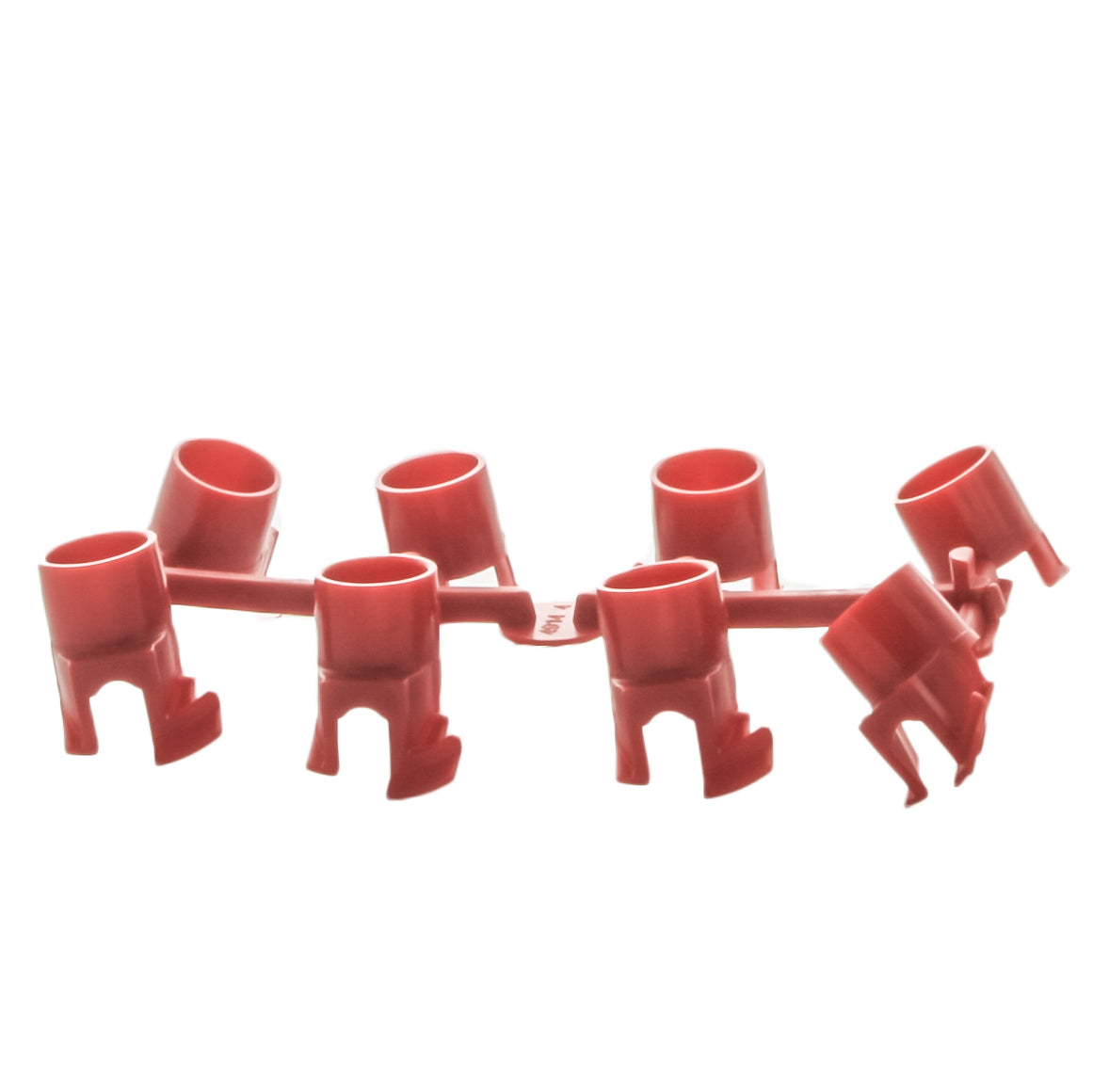 Close-up of red PGJ nozzle rack with visible nozzle numbers and standard-trajectory nozzle openings for flow control.