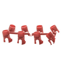 Close-up of red PGJ nozzle rack with visible nozzle numbers and standard-trajectory nozzle openings for flow control.