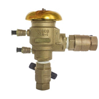 Close-up of Febco 765 pressure vacuum breaker bonnet and air opening port on the 1-inch bronze assembly for maintenance access.