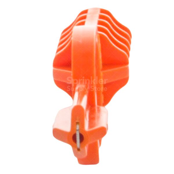 Close-up of the MPTOOL engaged with an MP Rotator nozzle, showing the arc adjustment ring and radius screw access for on-head tuning.