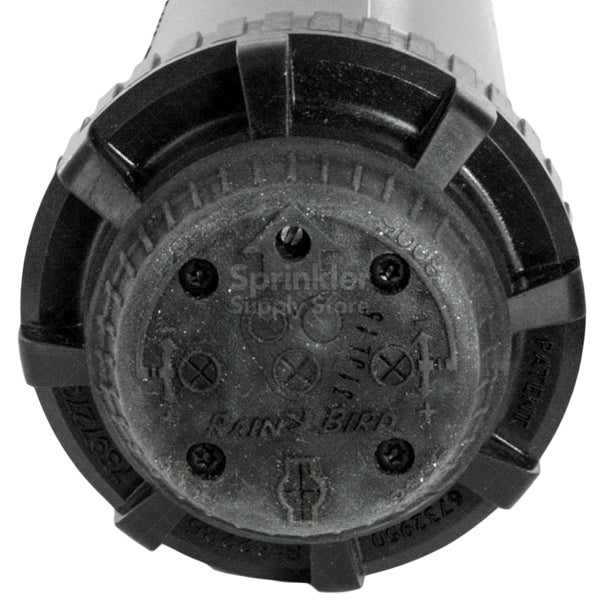 Close-up of Rain Bird 8005 rotor head and brass-reinforced turret, highlighting the top-access adjustment and Rain Curtain nozzle port.