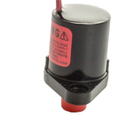 Close-up of Toro 89-0878 solenoid coil and terminal connector with visible plunger and spring components against white backdrop for parts identification.