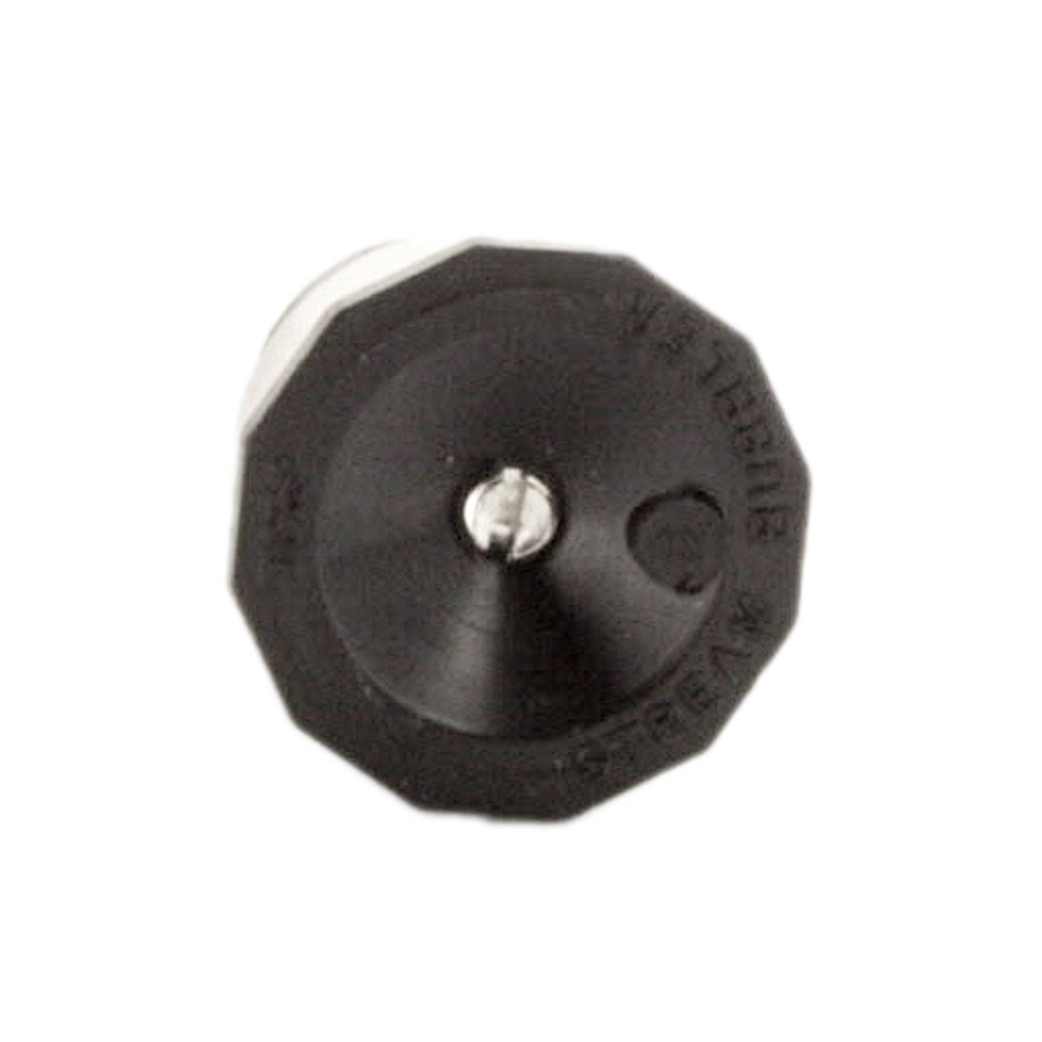 Packaged view of Toro 89-1806 nozzle alongside planting bed, demonstrating compact size and intended use for shrubs and groundcover.