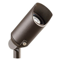 Kichler 15384AZT 12V mini MR16 landscape accent light in textured architectural bronze with ground stake and clear flat glass lens, shown outdoors.