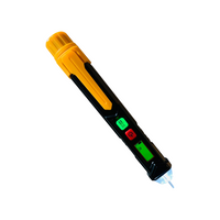 Armada PRO12 non-contact voltage detector with shielded probe tip, backlit LCD, headlight and push-button controls, black compact body (front view).