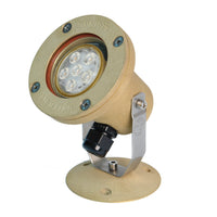 Atlantis 16 underwater light, weathered brass cast housing with glass lens, swivel bracket and 50' power lead visible.