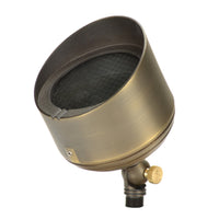 Weathered brass Unique Big Bang uplight, angled view showing adjustable knuckle, lens set, and ground stake, for outdoor use.