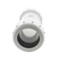 PVC CPC-1250 coupling assembled on a test pipe showing installed position, white PVC finish, and compact profile for confined spaces.