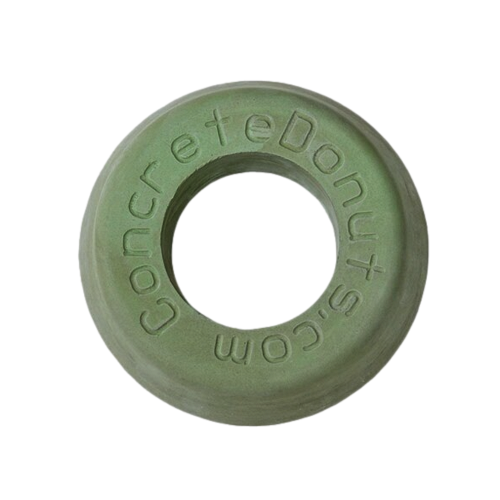 Green fiber-reinforced concrete donut sprinkler head protector (medium size) showing tapered outer edge and central opening.