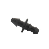Black Netafim barbed adapter (EDTUBEBA) shown from angle, highlighting UV-resistant molded plastic construction and ribbed barb.
