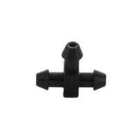 Front-angle close-up of Netafim EDTUBETEE 5mm barbed tee showing three barbed outlets and compact body for 1/4" micro tubing installation and secure fit.