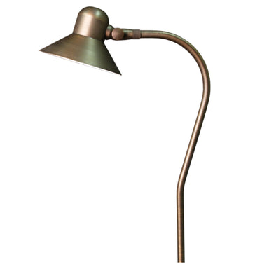 Excalibur brass path and area light with adjustable 5.45-inch bell shroud in weathered brass, shown mounted on a stabilizer stake and ground cable.